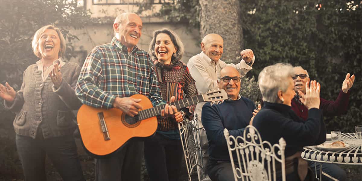 Seniors jamming to music at a backyard party